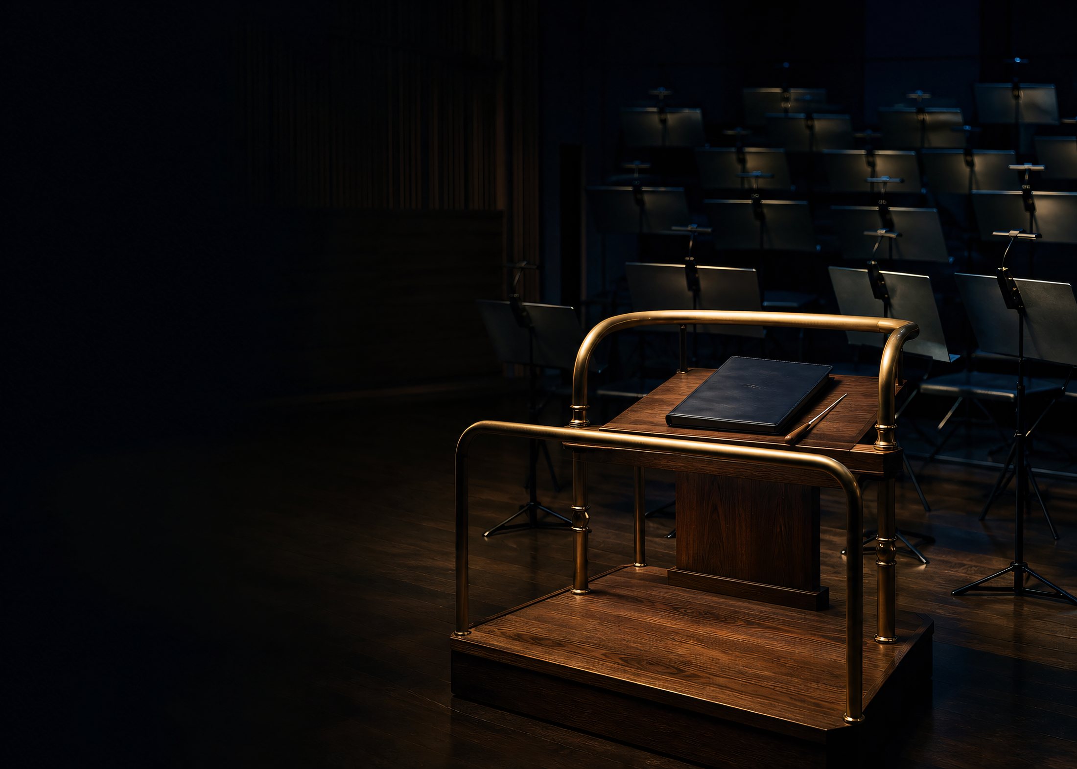 A conductor's podium under one warm spotlight, a closed leather folio and baton resting on it, rows of empty music stands fading into the dark